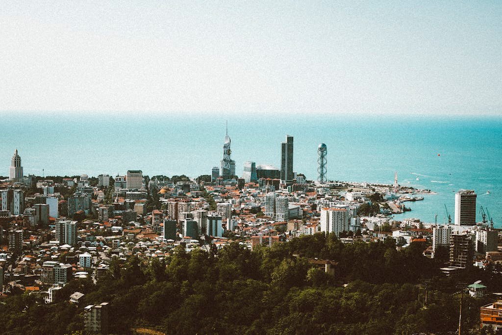Explore the stunning skyline and coastline of Batumi, Georgia from above. A perfect blend of urban and natural beauty.