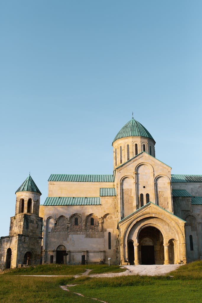Stunning view of Bagrati Cathedral in Kutaisi, Georgia, bathed in soft evening light.