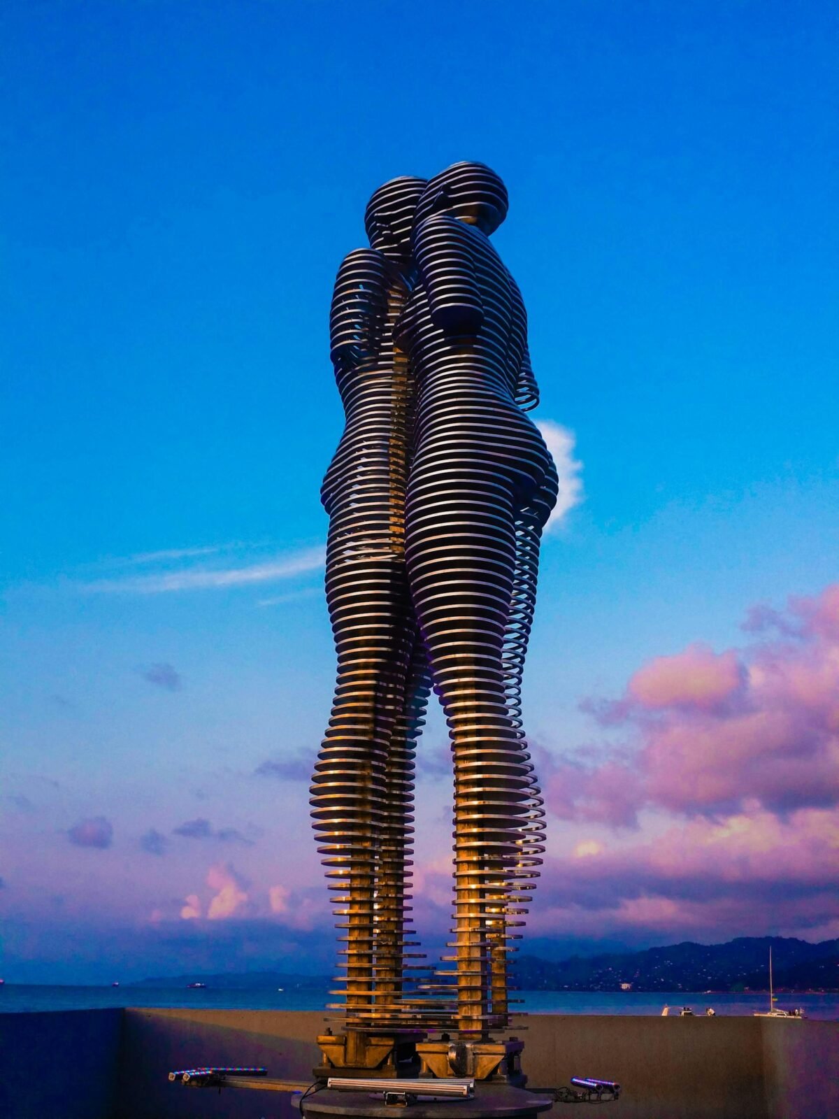 The Ali and Nino moving sculpture in Batumi, Georgia, captured against a stunning twilight sky.